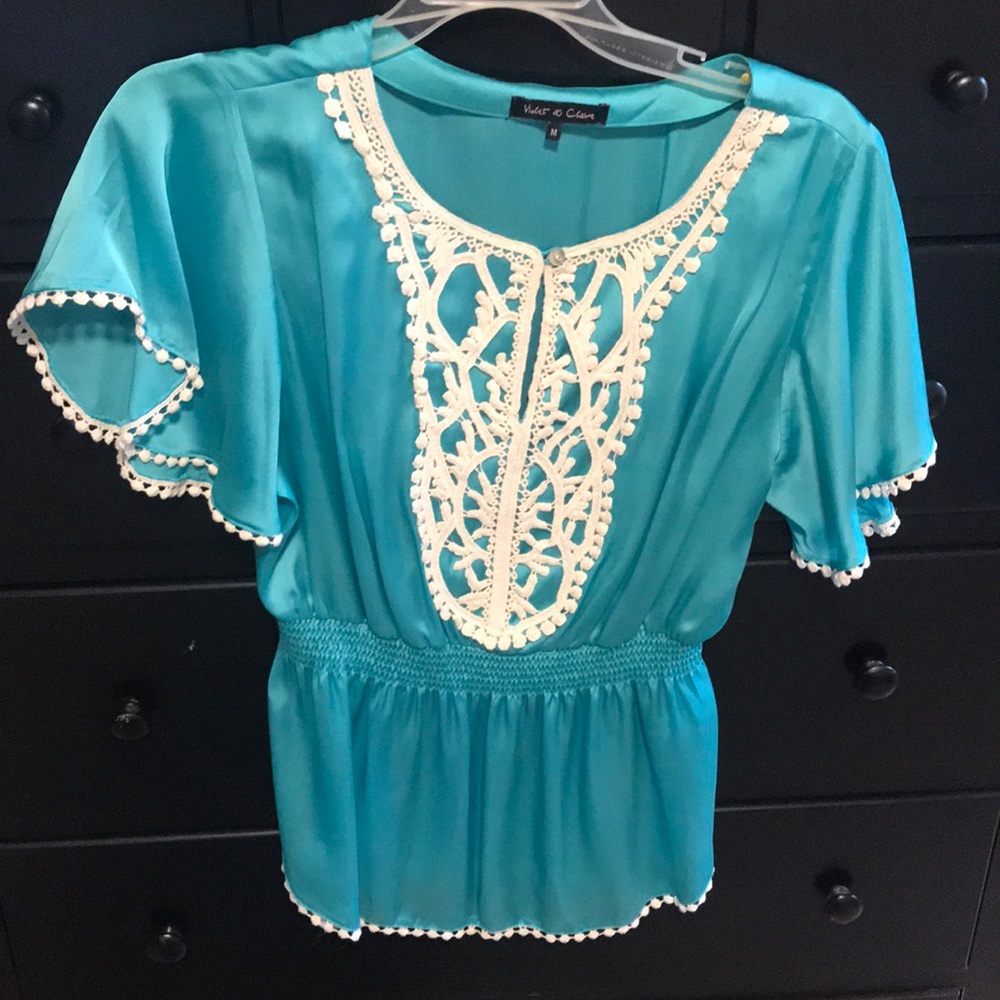 Beautiful teal blouse.